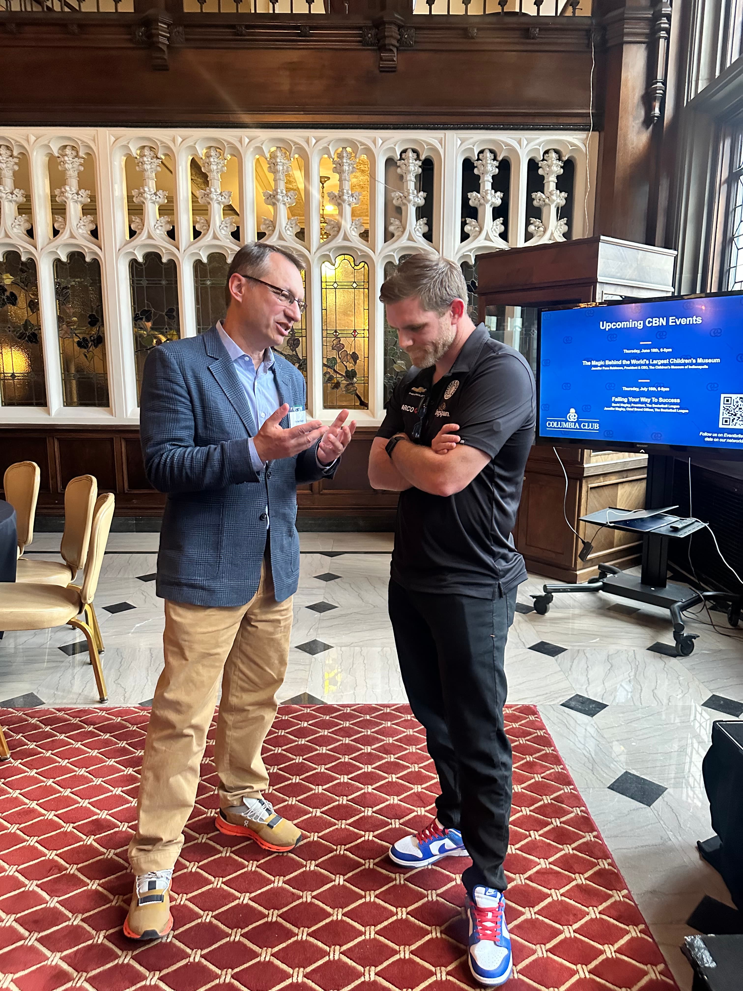 Mike Gogis explaining a point to a founder at an event